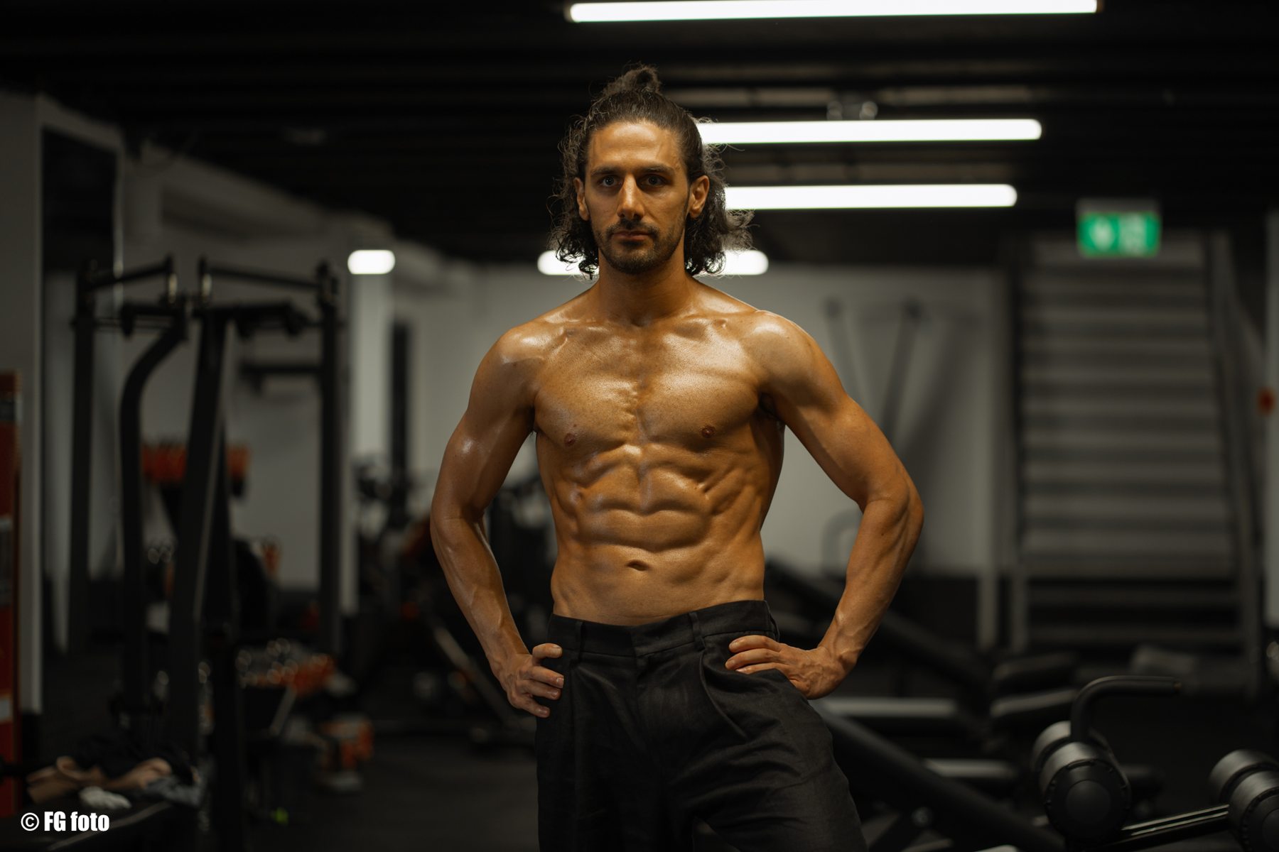 Fitness portrait of athlete in a gym photographed by FG Studio